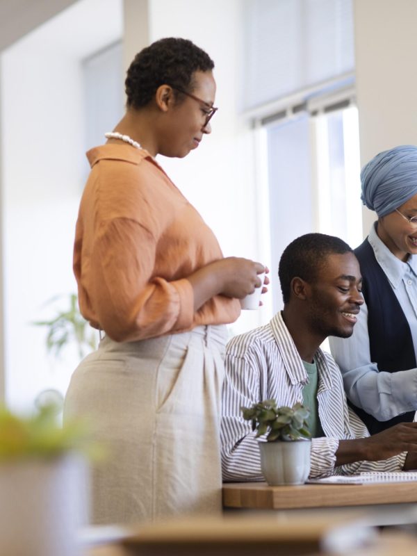 male-employee-getting-used-his-new-office-job-along-with-female-colleagues