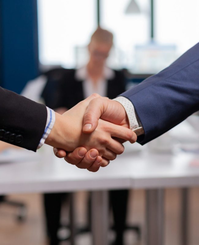 Satisfied businessman company employer wearing suit handshake new employee get hired at job interview, Man hr manager employ successful candidate shake hand at business meeting, placement concept